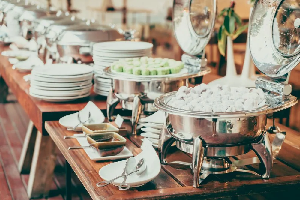 Dessert trays and stacked plates on a service counter
